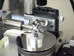 Figure 4. Testing device under development. Frictional vibrations being measured with a Laser Doppler Vibrometer and a high-resolution capacitive displacement meter.